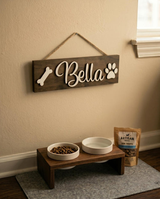 Pet name sign for Bella above a dog bowl