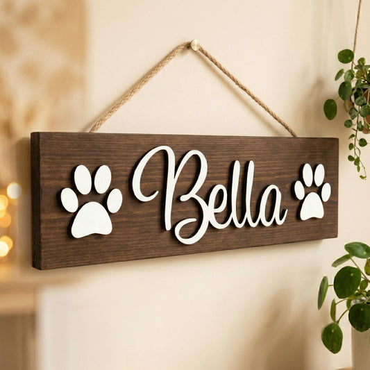 Personalized pet name wood sign with raised 3D cursive lettering and paw print and bone accents on stained pine