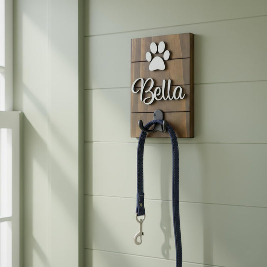 Personalized wooden dog leash holder sign with dog names in 3D lettering, paw prints and a hook for hanging a leash