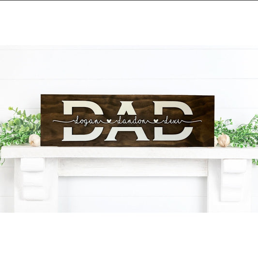 Personalized Dad wood sign with children's names in raised white 3D lettering on a stained board