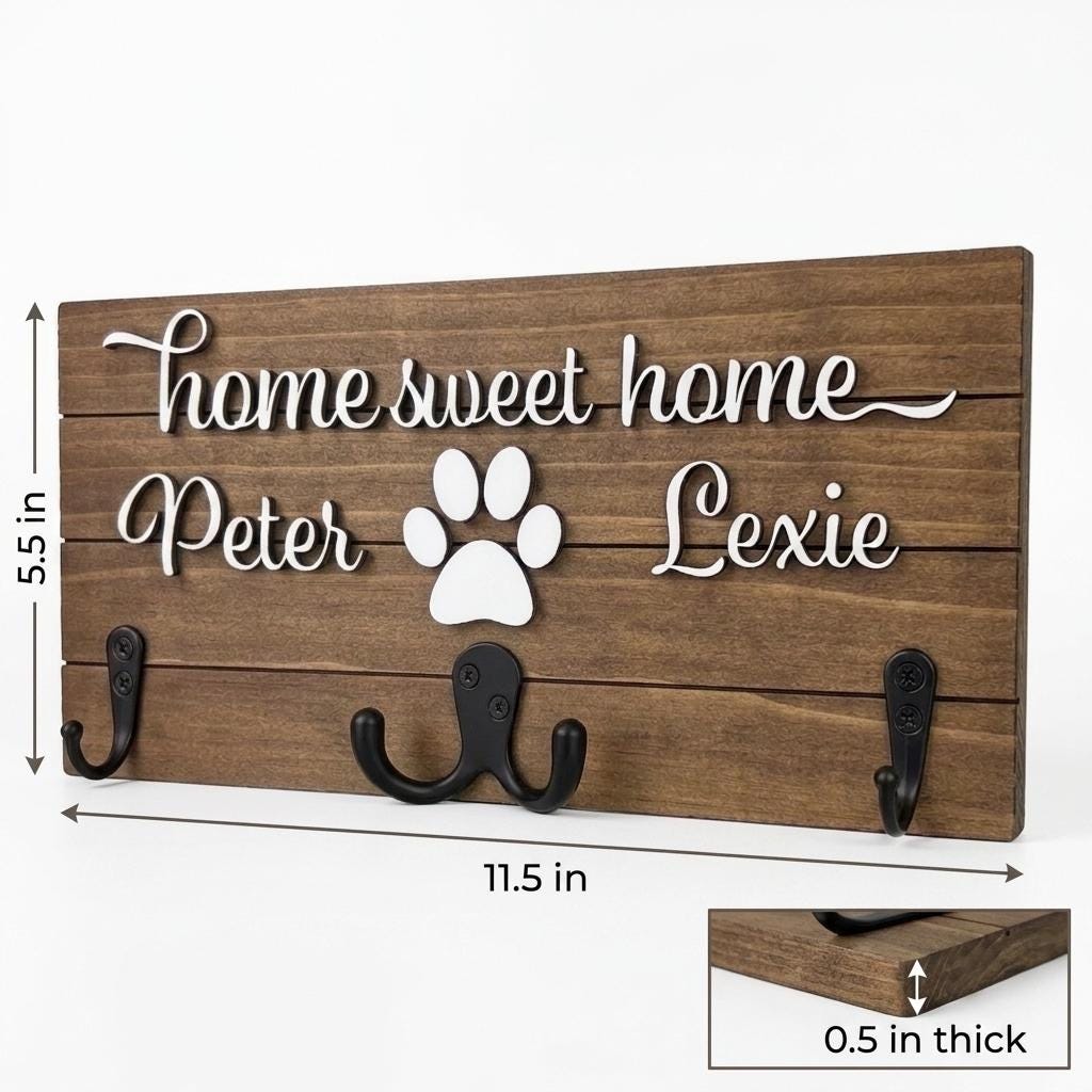 Home sweet home wood key and leash holder with 3D names around a raised white paw and black metal wall hooks