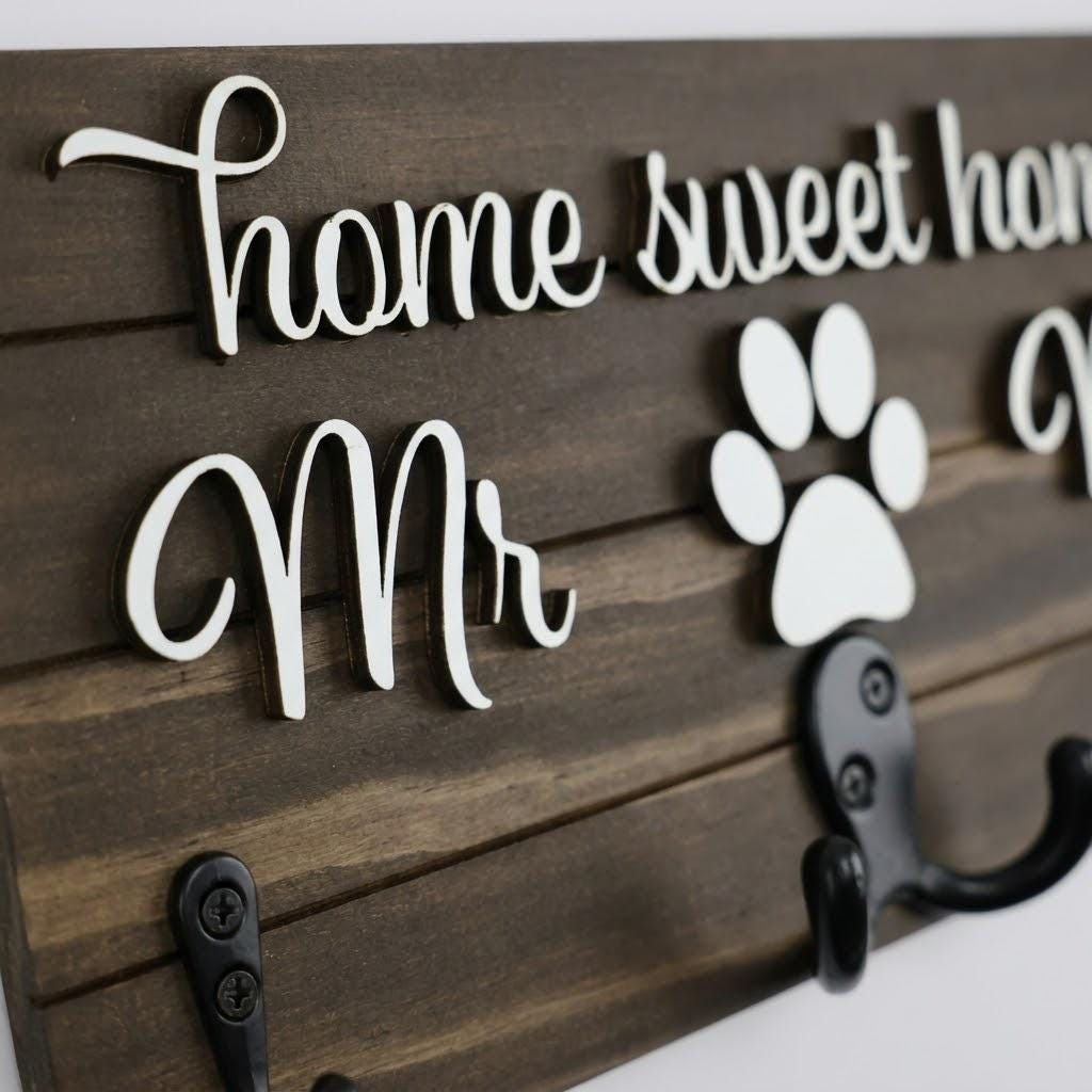 Home sweet home Mr and Mrs wood key and leash holder with white 3D lettering, paws over double hooks and black wall hooks
