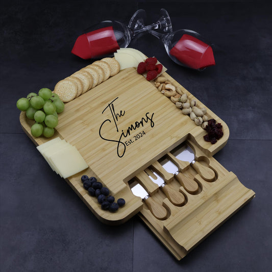 Personalized square bamboo charcuterie board set with slide-out utensil drawer and engraved design