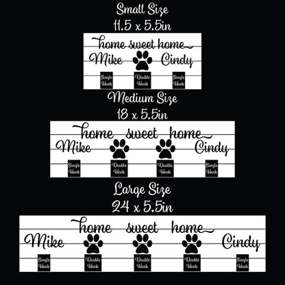 Home sweet home wood key and leash holder with 3D names around a raised white paw and black metal wall hooks